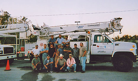 Several Northeast Texas Power employees take time from work to pose for a photo.