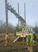 Northeast Texas Power crew installing electrical transmission poles