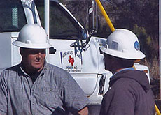 Northeast Texas Power crew consulting on a job
